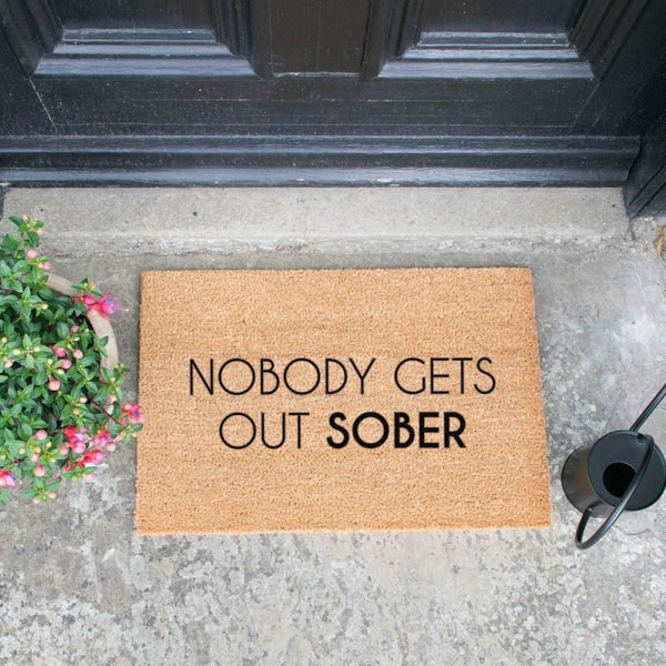 Nobody Gets Out Sober Doormat by Distinctly Living